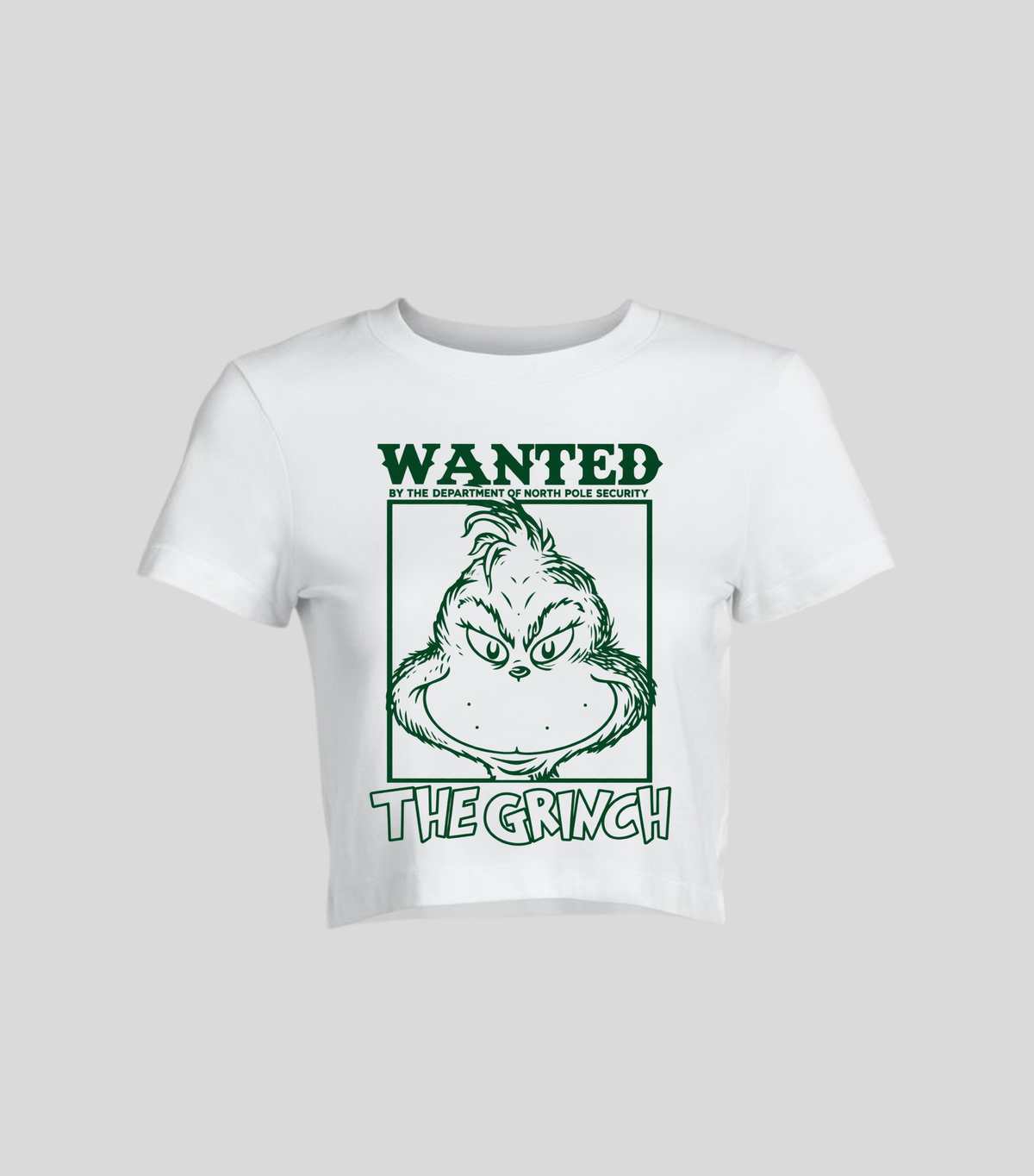 Wanted The Grinch — Crop top blanca con estampado navideño